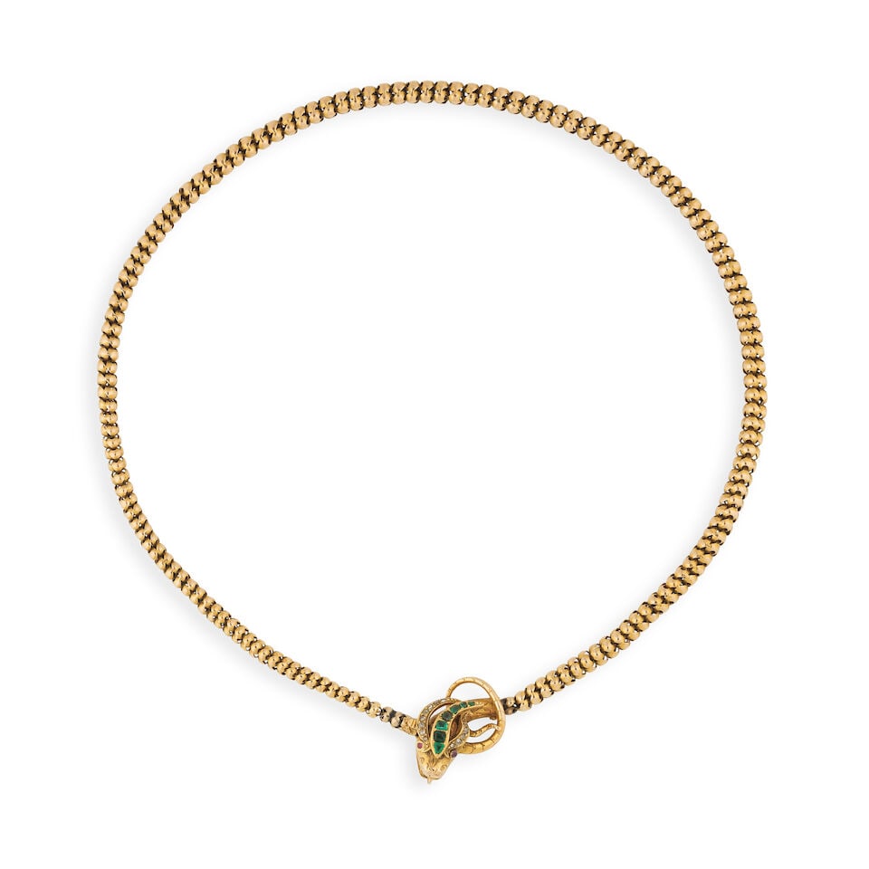 EMERALD, RUBY AND DIAMOND 'SNAKE' NECKLACE COLLIER SERPENT ÉMERAUDES, RUBIS ET DIAMANTS: EMERALD, RUBY AND DIAMOND 'SNAKE' NECKLACE COLLIER SERPENT ÉMERAUDES, RUBIS ET DIAMANTS • French import marks for 14 carat yellow gold (585 ‰) • Designed as a snake • 2 ca