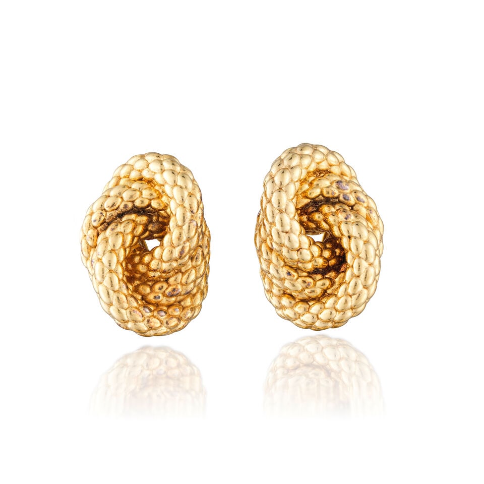PAIR OF GOLD EARCLIPS PAIRE DE CLIPS D'OREILLES EN OR: PAIR OF GOLD EARCLIPS PAIRE DE CLIPS D'OREILLES EN OR • French import mark for 18 carat textured yellow gold (750 ‰) • Measurements 2.8 x 3.8 cm • Total gross weight 13.19 gram