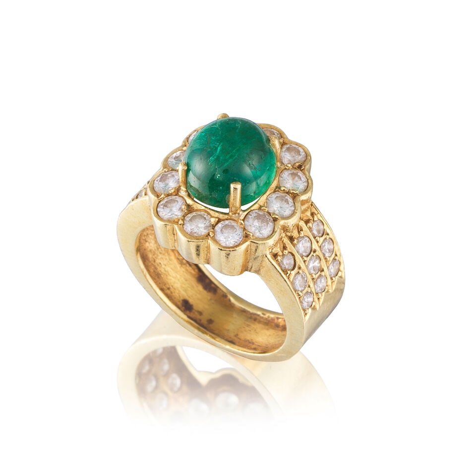 EMERALD AND DIAMOND RING BAGUE ÉMERAUDE ET DIAMANTS: EMERALD AND DIAMOND RING BAGUE ÉMERAUDE ET DIAMANTS • French import mark for 18 carat yellow gold (750 ‰) • 1 emerald cabochon weighing approximately 3.10 cts • Brilliant-