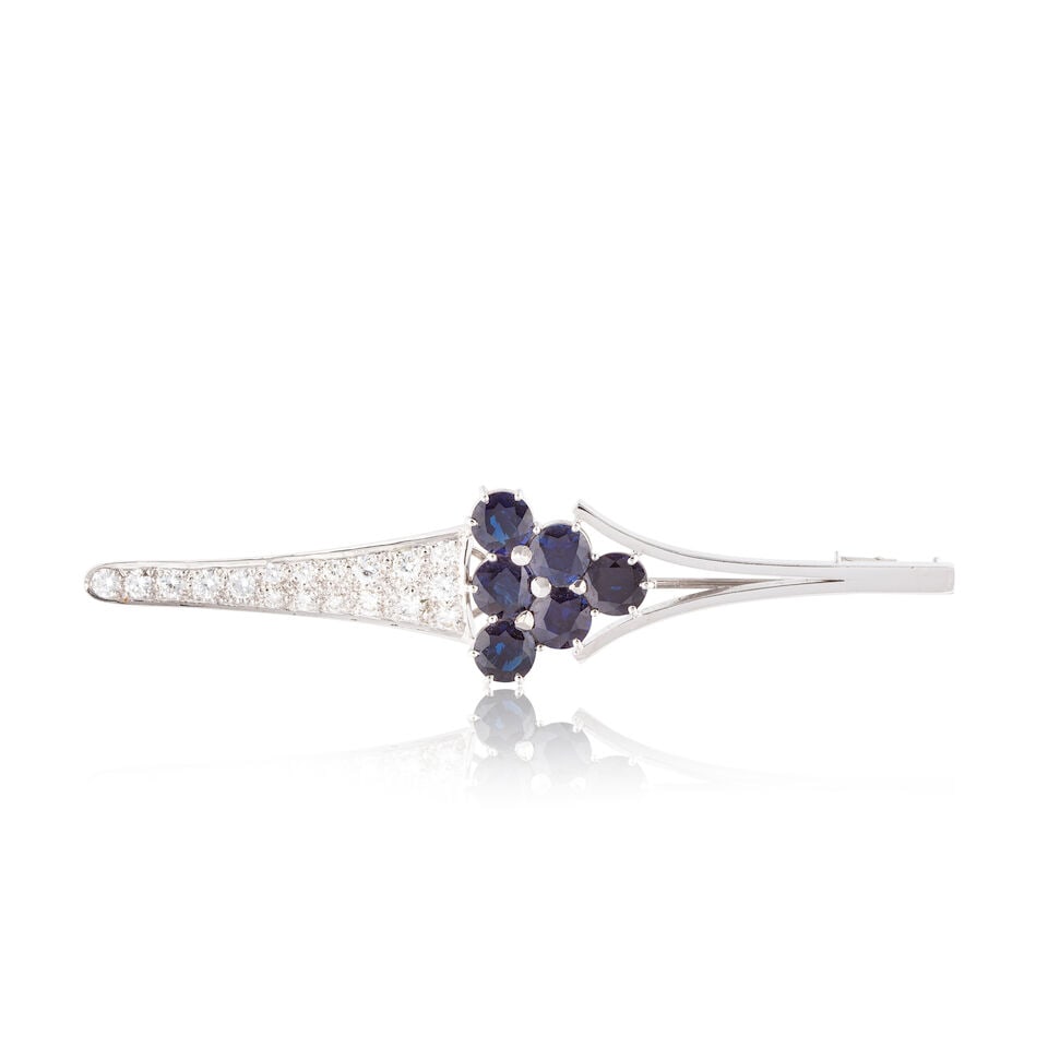 SAPPHIRE AND DIAMOND BROOCH BROCHE SAPHIRS ET DIAMANTS: SAPPHIRE AND DIAMOND BROOCH BROCHE SAPHIRS ET DIAMANTS • French import mark for 18 carat white gold (750 ‰) • 6 circular-cut sapphires weighing approximately 3.70 cts total • 1