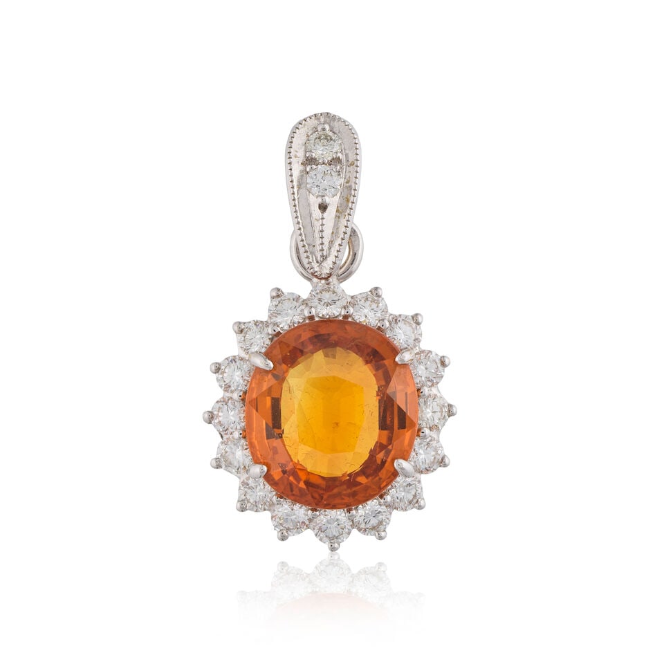 SAPPHIRE AND DIAMOND PENDANT PENDENTIF SAPHIR ET DIAMANTS: SAPPHIRE AND DIAMOND PENDANT PENDENTIF SAPHIR ET DIAMANTS • French import mark for 18 carat gold (750 ‰) • 1 oval-cut orange sapphire weighing approximately 8 cts • 18 brillian