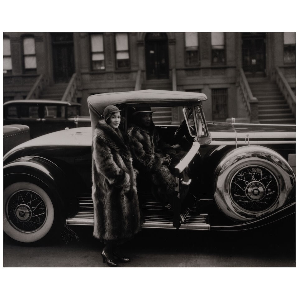 James Van Der Zee (1886-1983); Couple in Raccoon Coats, Harlem;: James Van Der Zee (1886-1983) Couple in Raccoon Coats, Harlem, 1932 Gelatin silver print, printed posthumously; credited and dated in the negative, the James Van Der Zee Estate blindstamp on the image