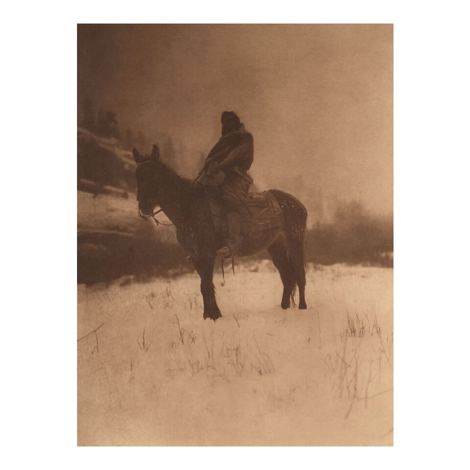 Edward S. Curtis (1868-1952); The Scout in Winter - Apsaroke (from Portfolio IV of 'The North Am...: Edward S. Curtis (1868-1952) The Scout in Winter - Apsaroke (from Portfolio IV of 'The North American Indian'), 1908 Large-format photogravure, printed 1909; with printed title, copyright credit, 'Pla