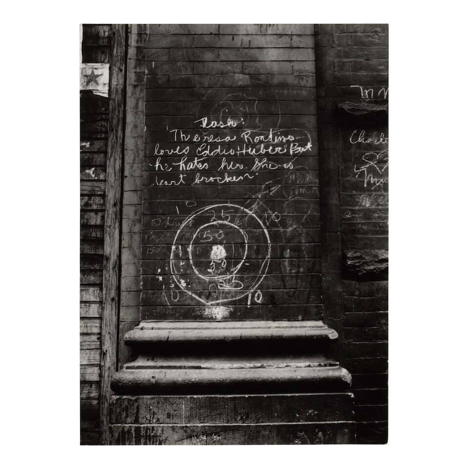 Helen Levitt (1913-2009); Untitled (Bullseye);: Helen Levitt (1913-2009) Untitled (Bullseye), 1938 Gelatin silver print; mounted, signed, dated, and annotated 'n.y.c.' in pencil on the reverse, framed, a Fraenkel Gallery label on the reverse. 8 1/4