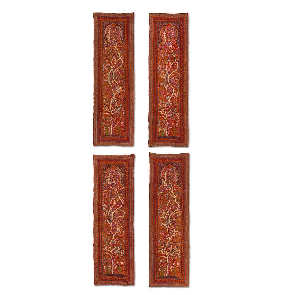 Four Qajar embroidered wool tree of life panels (pateh) Kirman, Persia, 19th Century (4): Four Qajar embroidered wool tree of life panels (pateh) Kirman, Persia, 19th Century each of rectangular form, the orange wool ground embroidered in polychrome wools with central panels containing int