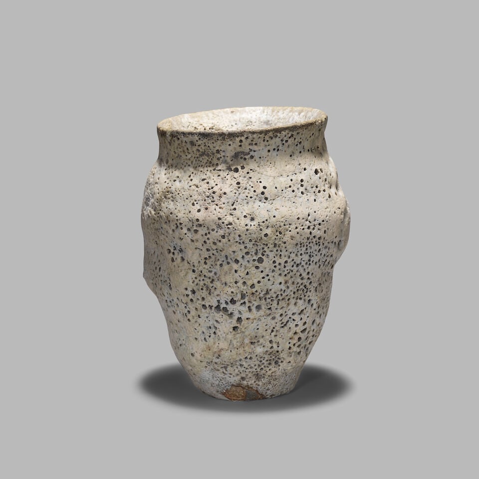 Aki Moriuchi Vase: Aki Moriuchi Vase Stoneware, undulating organic form with volcanic glaze. 15.2 x 11 x 10.2 cm Impressed with artist's seal. This lot is subject to the following lot symbols: AR AR Goods subject to Art