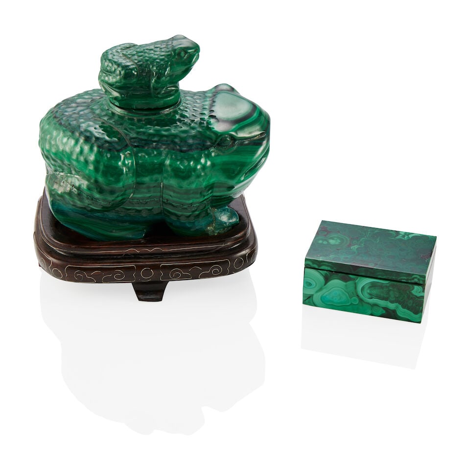 GROUP OF TWO MALACHITE DESK ACCESSORIES: GROUP OF TWO MALACHITE DESK ACCESSORIES • One malachite inkwell with lid, carved as two toads, with fitted wooden base, measures 3 3/4 x 2 3/4 x 3 in. • One malachite box with lid, measure