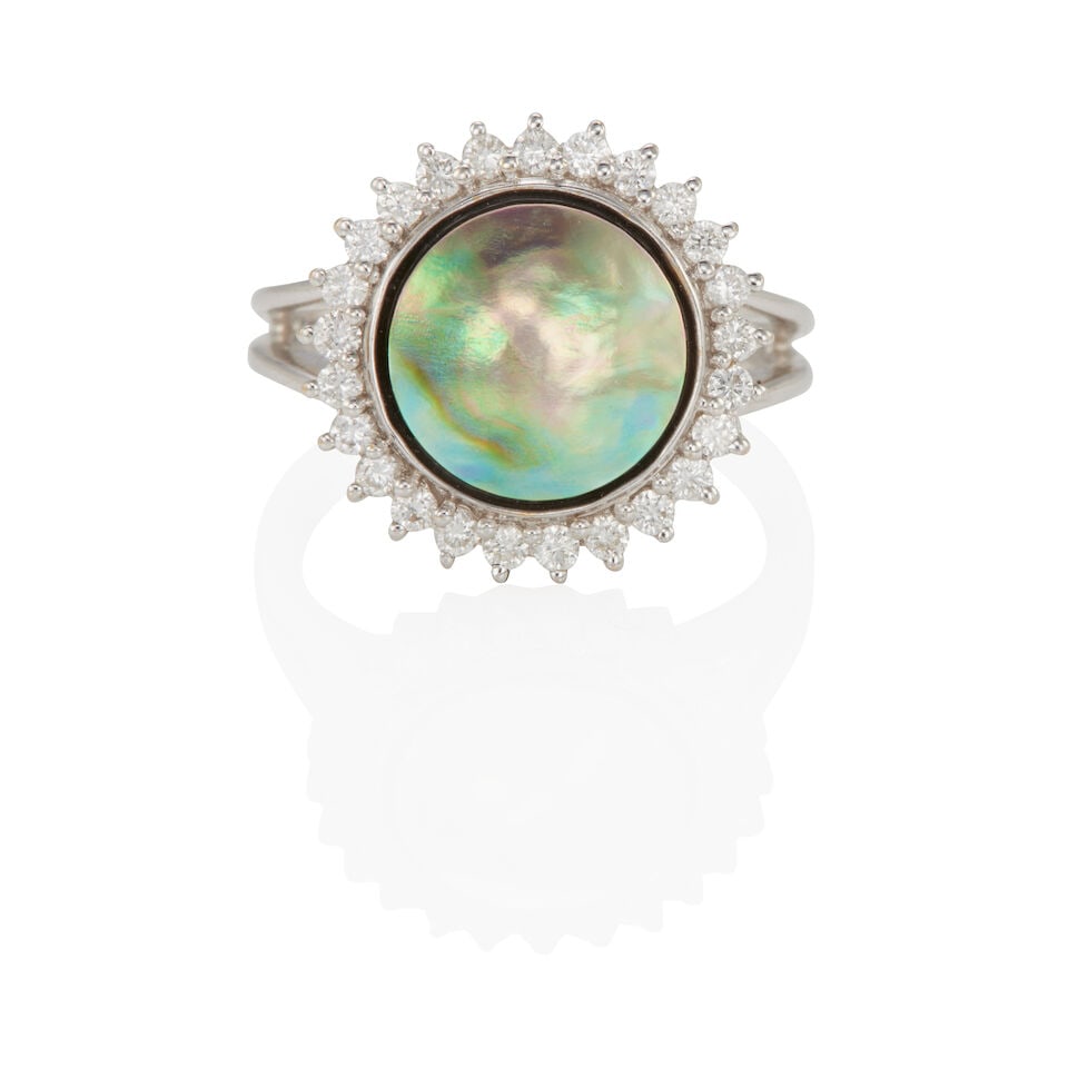 18K GOLD, ABALONE AND DIAMOND RING: 18K GOLD, ABALONE AND DIAMOND RING • 18k white gold • 1 round abalone tablet measuring approximately 9.92 mm • Numerous round diamonds weighing approximately 0.25 - 0.35 carat total