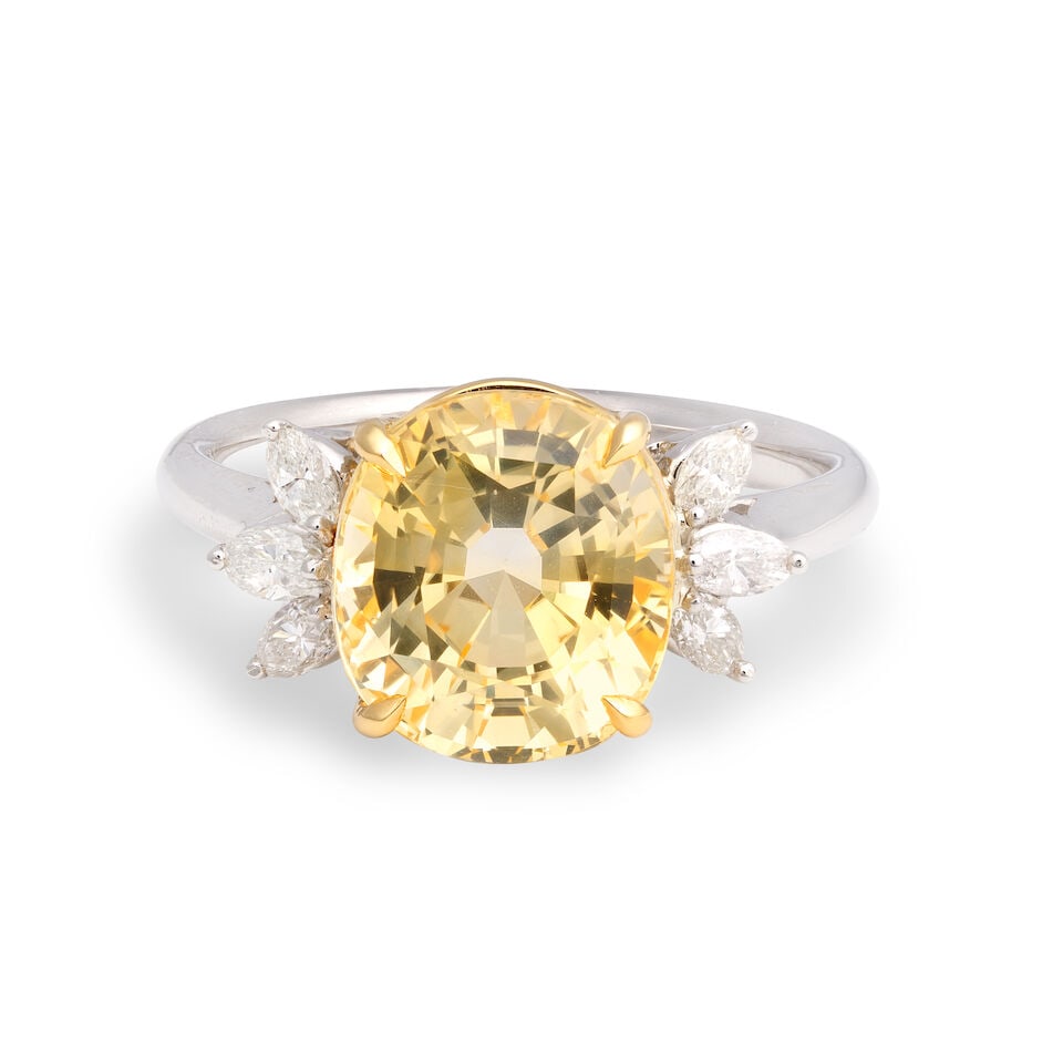 YELLOW SAPPHIRE AND DIAMOND RING: YELLOW SAPPHIRE AND DIAMOND RING Cushion shaped yellow sapphire Marquise-cut diamonds, approx. 0.20ct total Ring size approx. N Weight approx. 6.5g Footnotes: OVERALL CONDITION Negligible surface wear
