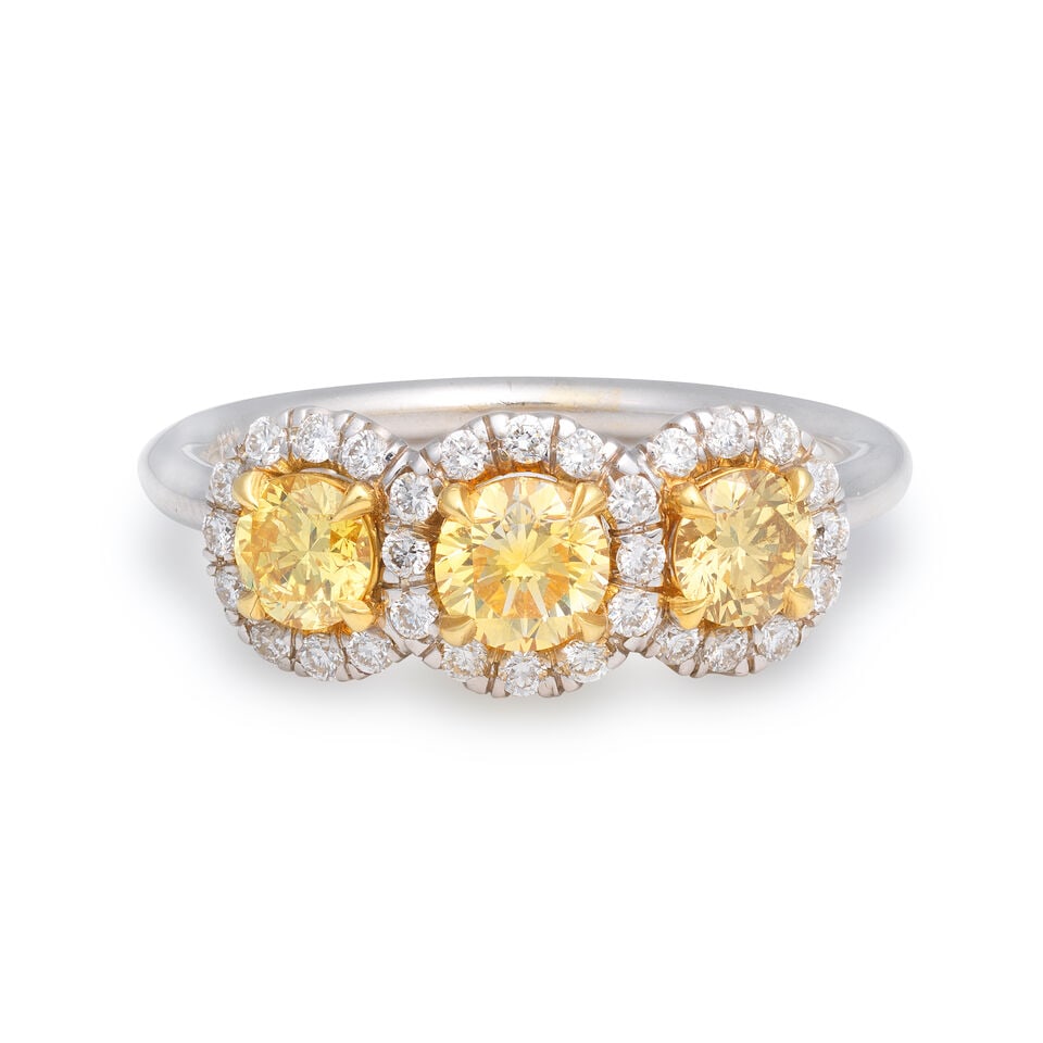 COLOURED DIAMOND AND DIAMOND THREE STONE CLUSTER RING: COLOURED DIAMOND AND DIAMOND THREE STONE CLUSTER RING Brilliant-cut coloured diamonds approx. 0.85ct total (untested for natural colour and origin) Brilliant-cut diamonds approx. 0.30ct total Ring siz