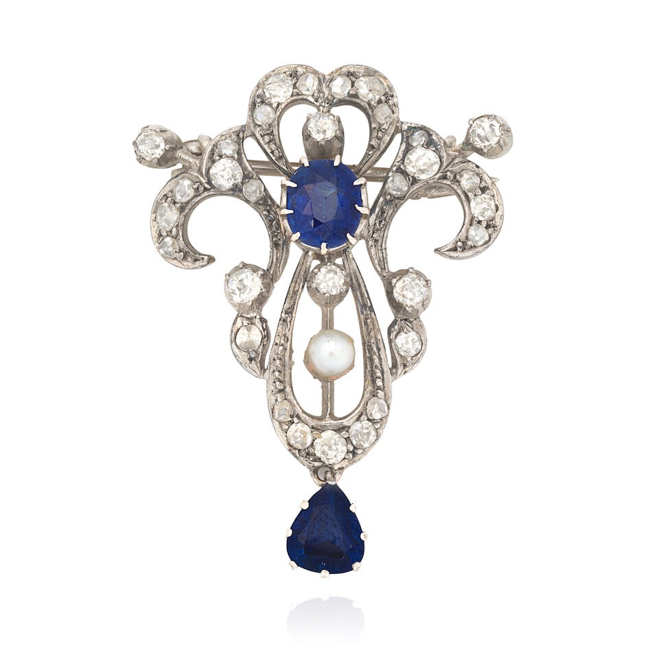 SAPPHIRE, DIAMOND AND PEARL BROOCH, EARLY 20TH CENTURY: SAPPHIRE, DIAMOND AND PEARL BROOCH, EARLY 20TH CENTURY Oval and pear-cut sapphires Old-cut diamonds, approx. 0.50ct total Length 3.2cm Weight approx. 5.3g Footnotes: OVERALL CONDITION Some surface wea