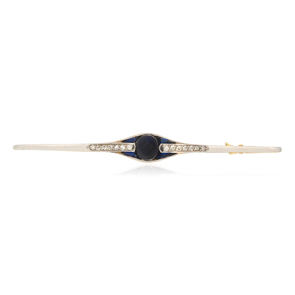 SYNTHETIC SAPPHIRE AND DIAMOND BAR BROOCH, CIRCA 1910: SYNTHETIC SAPPHIRE AND DIAMOND BAR BROOCH, CIRCA 1910 Synthetic sapphire cabochon Synthetic calibré-cut sapphires Single-cut diamonds Length 7.0cm Weight approx. 5.5g Cased by Asprey Footnotes: O