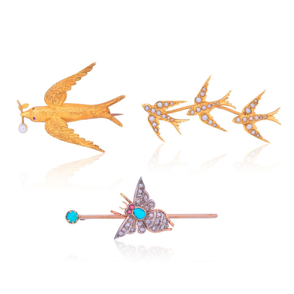 THREE GEM-SET BROOCHES: THREE GEM-SET BROOCHES 1st: Gem-set swallow brooch Pearl (untested) Length 3.5cm Weight approx. 4.0g Fitted case by The Goldsmiths & Silversmiths Company 2nd: Gem-set moth brooch Turquoise