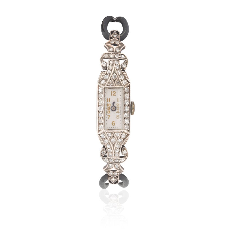 DIAMOND-SET COCKTAIL WATCH, CIRCA 1935: DIAMOND-SET COCKTAIL WATCH, CIRCA 1935 Single-cut diamonds, approx. 0.90ct total Length 19.0cm Weight approx. 15.5g Footnotes: OVERALL CONDITION Some surface wear to the unhallmarked metal stamped wit