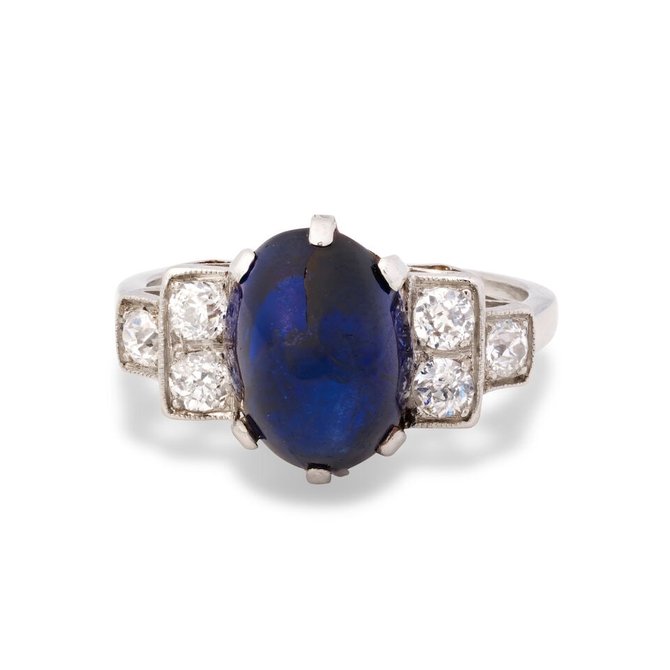 SAPPHIRE AND DIAMOND RING: SAPPHIRE AND DIAMOND RING Sapphire cabochon Old brilliant-cut diamonds, approx. 0.40ct total Ring size approx. J Weight approx. 4.5g Footnotes: OVERALL CONDITION Light surface wear to unhallmarked