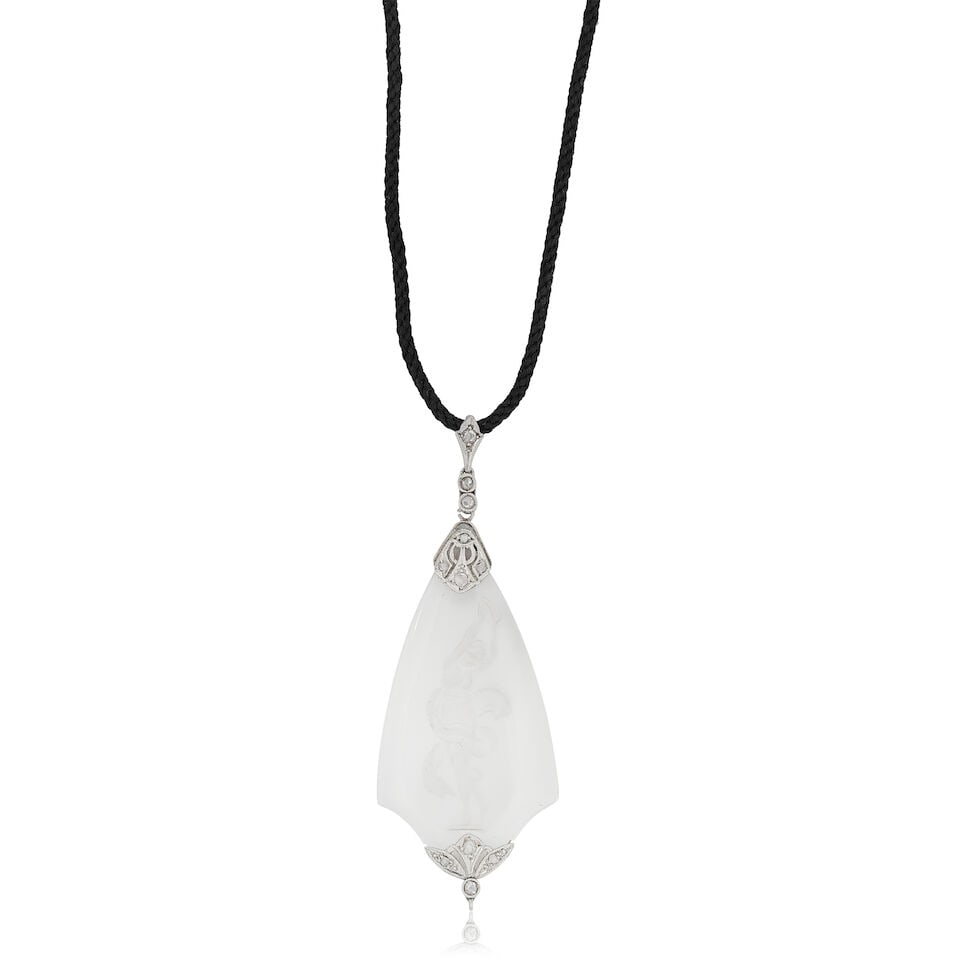 CARVED ROCK CRYSTAL AND DIAMOND PENDANT: CARVED ROCK CRYSTAL AND DIAMOND PENDANT Reverse carved rock crystal depicting a female figure Rose-cut diamonds Pendant length 5.5cm Weight approx. 6.0g Footnotes: OVERALL CONDITION Light surface wear