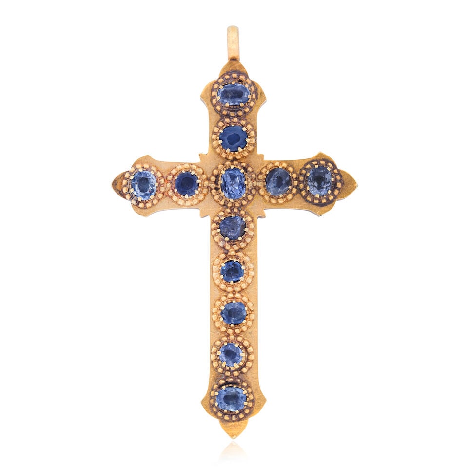 SAPPHIRE CROSS: SAPPHIRE CROSS Circular and oval-cut sapphires Length 7.0cm including bale Weight approx. 16.0g Footnotes: OVERALL CONDITION Some surface wear to unhallmarked metal testing as 12kt gold. Small spots o