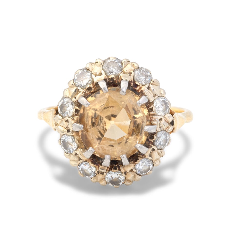 TOPAZ CLUSTER RING: TOPAZ CLUSTER RING Circular-cut brown topaz Brilliant-cut diamonds, approx. 0.40ct total Ring size approx. J½ (sizing beads) Weight approx. 6.0g Footnotes: OVERALL CONDITION Light surface wear to