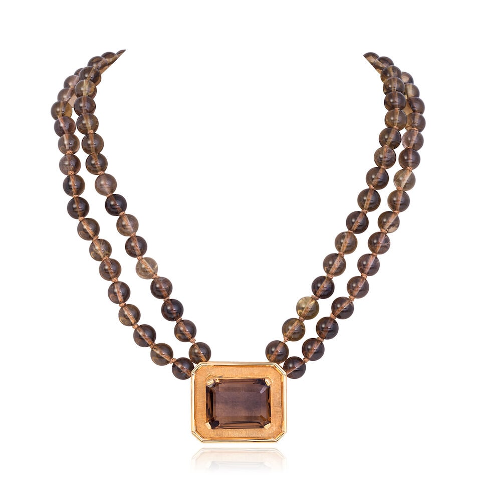 NICHOLAS WYLDE: SMOKY QUARTZ NECKLACE: NICHOLAS WYLDE: SMOKY QUARTZ NECKLACE Octagonal step-cut and beads of smoky quartz 9 carat gold Maker's mark NAW, UK hallmark Length 43.0cm Weight approx. 90.5g Footnotes: OVERALL CONDITION Light surf