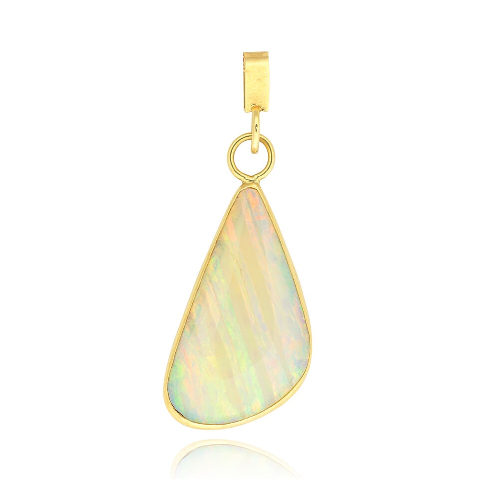 OPAL PENDANT, 1990: OPAL PENDANT, 1990 Opal cabochon slice 18 carat gold London hallmark Accompanied by base metal trace-link chain Length of pendant including bale approx. 4.5cm Weight of pendant 3.5g Footnotes: OVERALL
