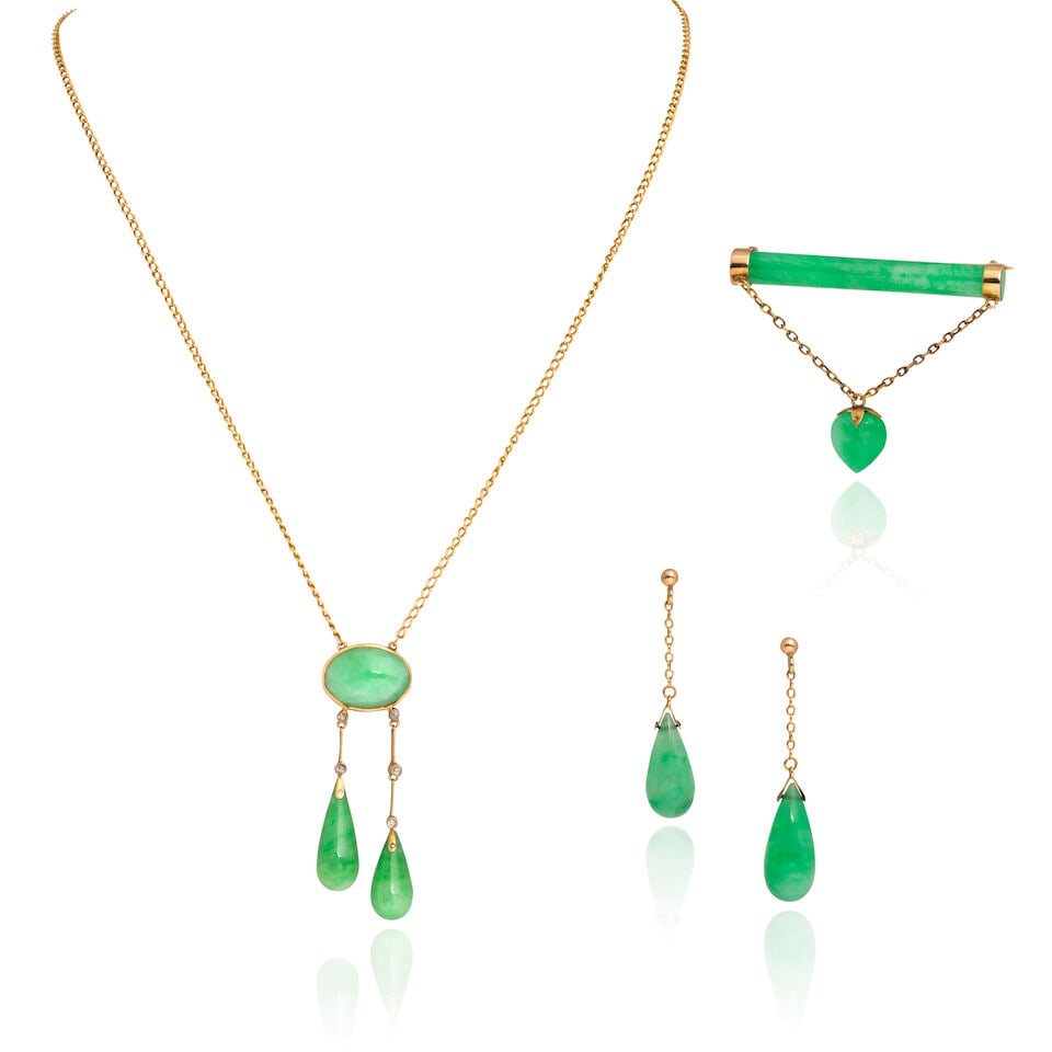 JADEITE AND DIAMOND SUITE: JADEITE AND DIAMOND SUITE Carved jadeite brooch, earrings and pendant necklace Rose-cut diamonds Lengths: necklace 44.0cm, earrings 4.0cm, brooch width 4.5cm Total weight approx. 19.5g Footnotes: OVER