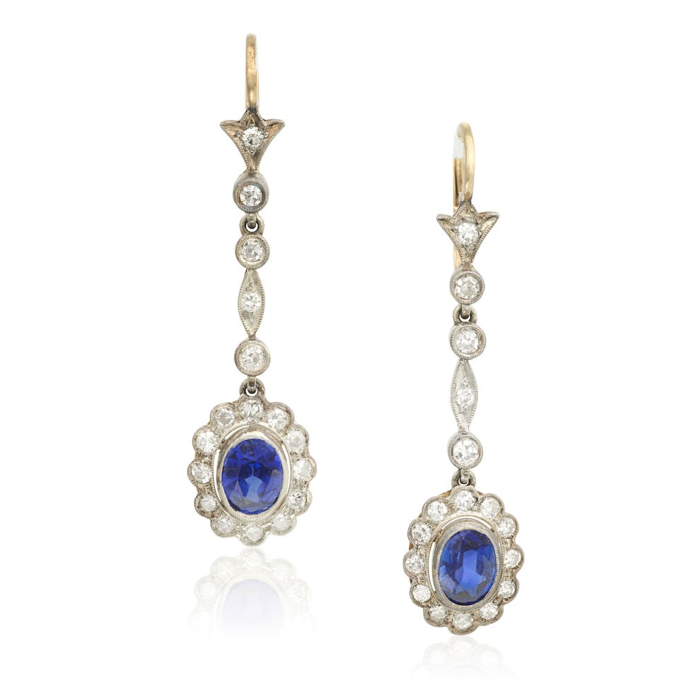 SYNTHETIC SAPPHIRE AND DIAMOND PENDENT EARRINGS: SYNTHETIC SAPPHIRE AND DIAMOND PENDENT EARRINGS Oval-cut synthetic sapphires Single-cut diamonds approx. 0.70ct total Length 4.5cm Total weight approx. 6.0g Footnotes: OVERALL CONDITION Unhallmarked