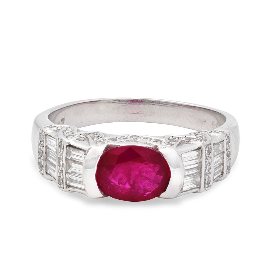 RUBY AND DIAMOND RING: RUBY AND DIAMOND RING Oval-cut ruby Brilliant and baguette-cut diamonds approx. 0.65ct total Ring size approx. O½ Weight approx. 5.5g Footnotes: OVERALL CONDITION Light surface wear to unhallmark