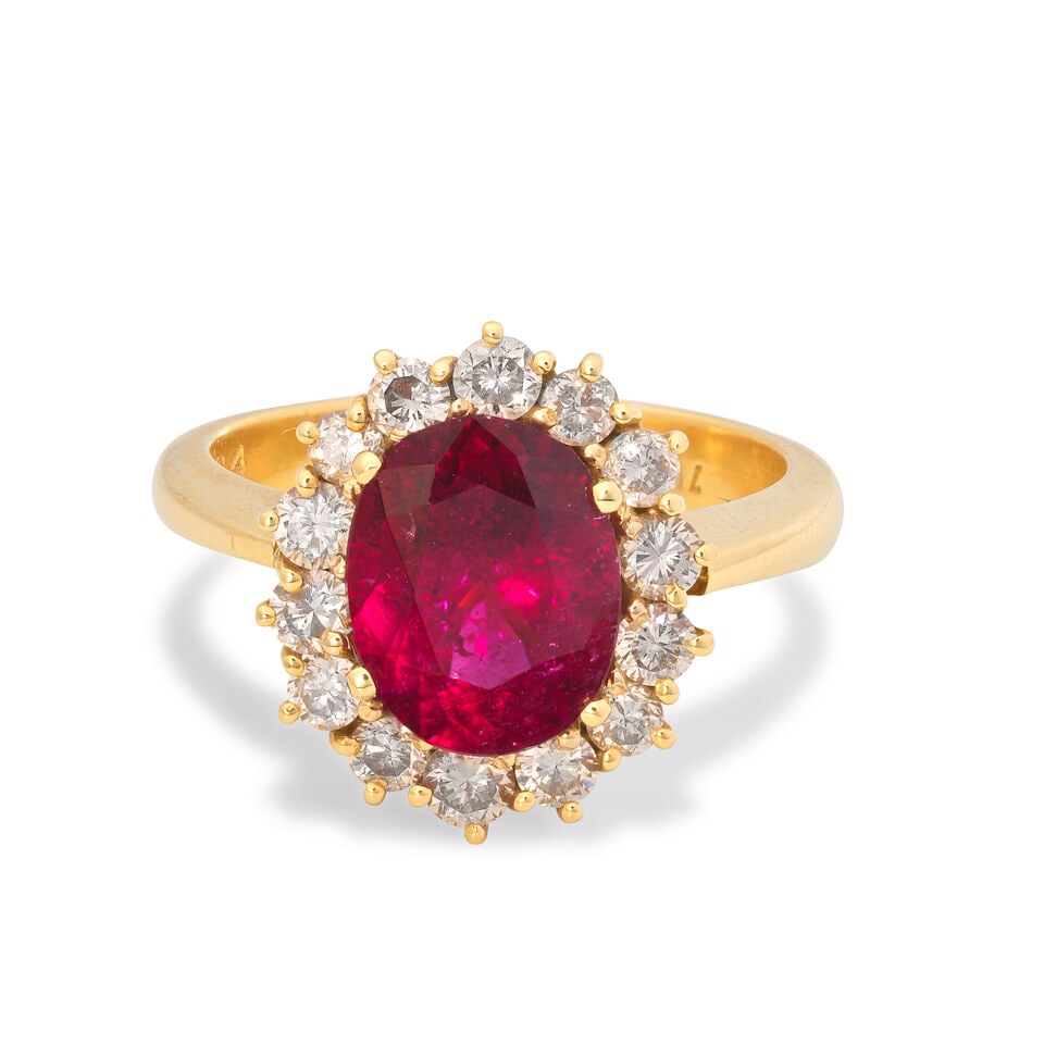 PINK TOURMALINE AND DIAMOND CLUSTER RING: PINK TOURMALINE AND DIAMOND CLUSTER RING Oval-cut tourmaline Brilliant-cut diamonds, approx. 0.80ct total Ring size approx. N Weight approx. 7.5g Footnotes: OVERALL CONDITION Light surface wear to unh