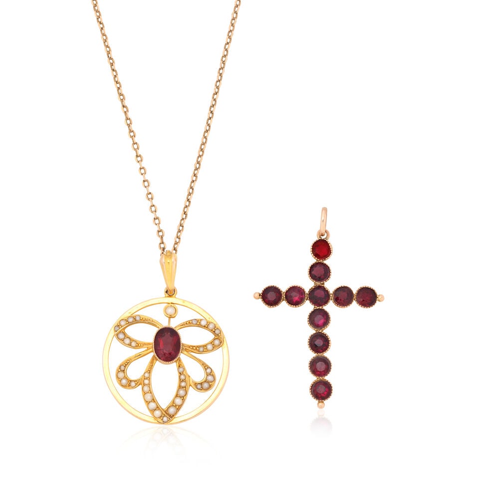 TWO GARNET PENDANTS: TWO GARNET PENDANTS 1st: Garnet and seed pearl pendant Oval-cut garnet Seed pearls Lengths: pendant 4.0cm including bale, chain 44.0cm 2nd: Garnet cross Circular-cut garnets Length approx. 4.5cm