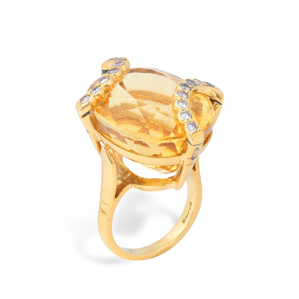 CITRINE AND DIAMOND RING, 1979: CITRINE AND DIAMOND RING, 1979 Oval-cut citrine Single-cut diamonds, approx. 0.30ct total Partial London hallmark Ring size approx. M Weight approx. 19.5g Footnotes: OVERALL CONDITION Light surface we