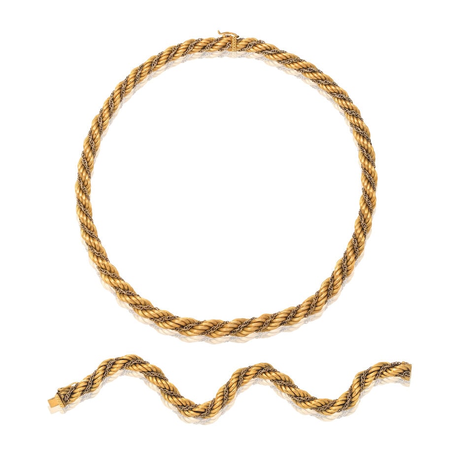NECKLACE AND BRACELET SUITE (2): NECKLACE AND BRACELET SUITE Of ropetwist design Length: necklace 44.5cm, bracelet length 21.0cm Total weight approx. 82.5g (2) Footnotes: OVERALL CONDITION Light surface wear to unhallmarked metal