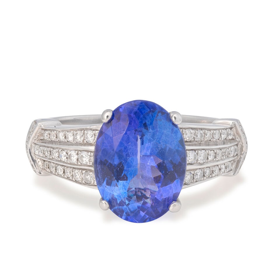 TANZANITE AND DIAMOND RING, 2016: TANZANITE AND DIAMOND RING, 2016 Oval-cut tanzanite Brilliant-cut diamonds, approx. 0.20ct total 18 carat gold UK hallmark Ring size approx. N½ Weight approx. 6.0g Footnotes: OVERALL CONDITION Li