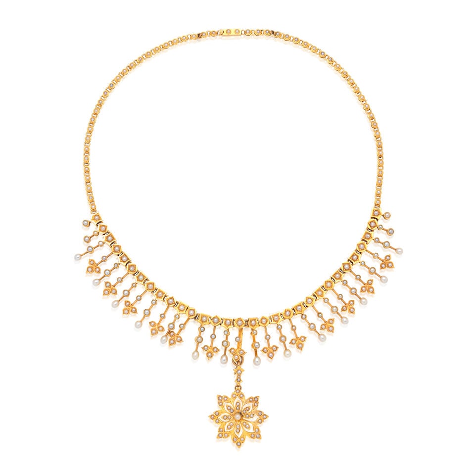 SEED PEARL FRINGE NECKLACE, CIRCA 1890: SEED PEARL FRINGE NECKLACE, CIRCA 1890 Seed pearls Mounted in gold Detachable pendant Lengths: necklace 40.5cm, pendant 4.0cm Weight approx. 38.5g Footnotes: The necklace is shown worn by Ethelette
