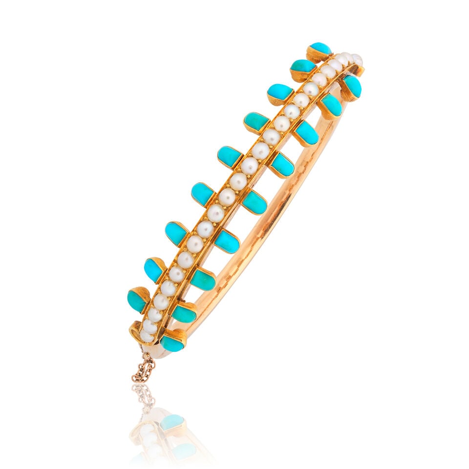 SEED PEARL AND TURQUOISE BANGLE: SEED PEARL AND TURQUOISE BANGLE Seed pearls Turquoise cabochons Inner circumference approx. 17.0cm Weight approx. 21.5g Footnotes: OVERALL CONDITION Light surface wear to unhallmarked metal testing