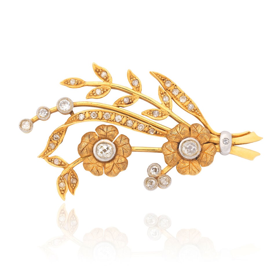 DIAMOND-SET FLORAL BROOCH: DIAMOND-SET FLORAL BROOCH Old single and brilliant-cut diamonds approx. 0.90ct total Length 5.5cm Weight approx. 12.0g Footnotes: OVERALL CONDITION Light surface wear to unhallmarked metal stamped