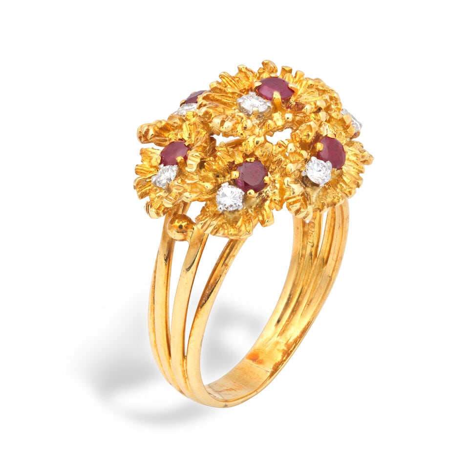 RUBY AND DIAMOND-SET FLOWER RING, 1971: RUBY AND DIAMOND-SET FLOWER RING, 1971 Circular-cut rubies Brilliant-cut diamonds 18 carat gold Maker's mark, London hallmark Ring size approx. U½ Weight approx. 12.5g Footnotes: OVERALL