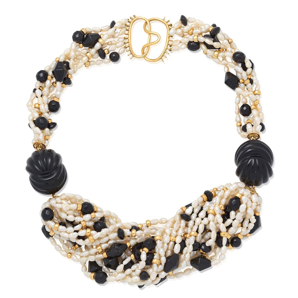 CULTURED PEARL AND ONYX TORSADE NECKLACE: CULTURED PEARL AND ONYX TORSADE NECKLACE Cultured pearls Carved onyx beads Length 52.0cm Weight approx. 214.0g Footnotes: Jewellery from a Private American Collection This piece comes from a