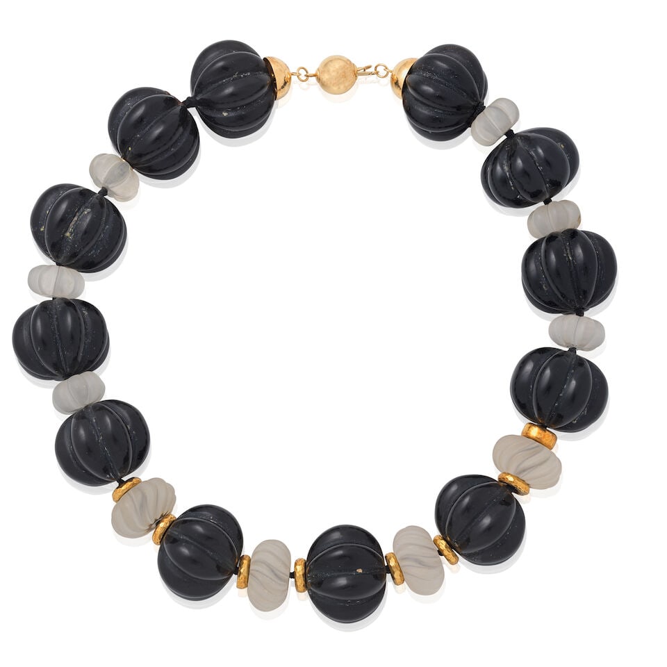 CARVED ROCK CRYSTAL AND ONYX BEAD NECKLACE: CARVED ROCK CRYSTAL AND ONYX BEAD NECKLACE Carved onyx and rock crystal Length 42.5cm Weight approx. 255.5g Footnotes: Jewellery from a Private American Collection This piece comes from a