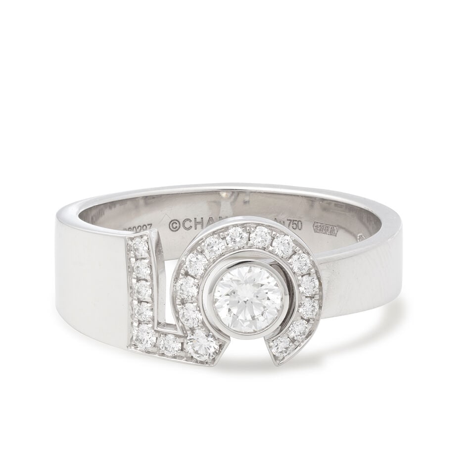 CHANEL: 'ETERNAL NO.5' DIAMOND RING: CHANEL: 'ETERNAL NO.5' DIAMOND RING Principal brilliant-cut diamond 0.25ct Remaining brilliant-cut diamonds approx. 0.20ct total 18 carat gold Signed Chanel, numbered B60297, maker's mark CL, London