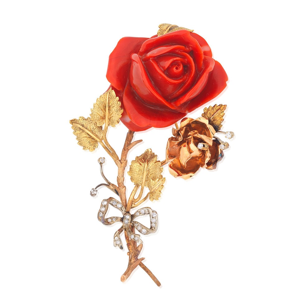 CORAL AND DIAMOND-SET BROOCH: CORAL AND DIAMOND-SET BROOCH Coral corallium rubrum Single-cut diamonds Length 9.0cm Weight approx. 53.5g Footnotes: Please note this lot will be subject to US Fish and Wildlife inspection if