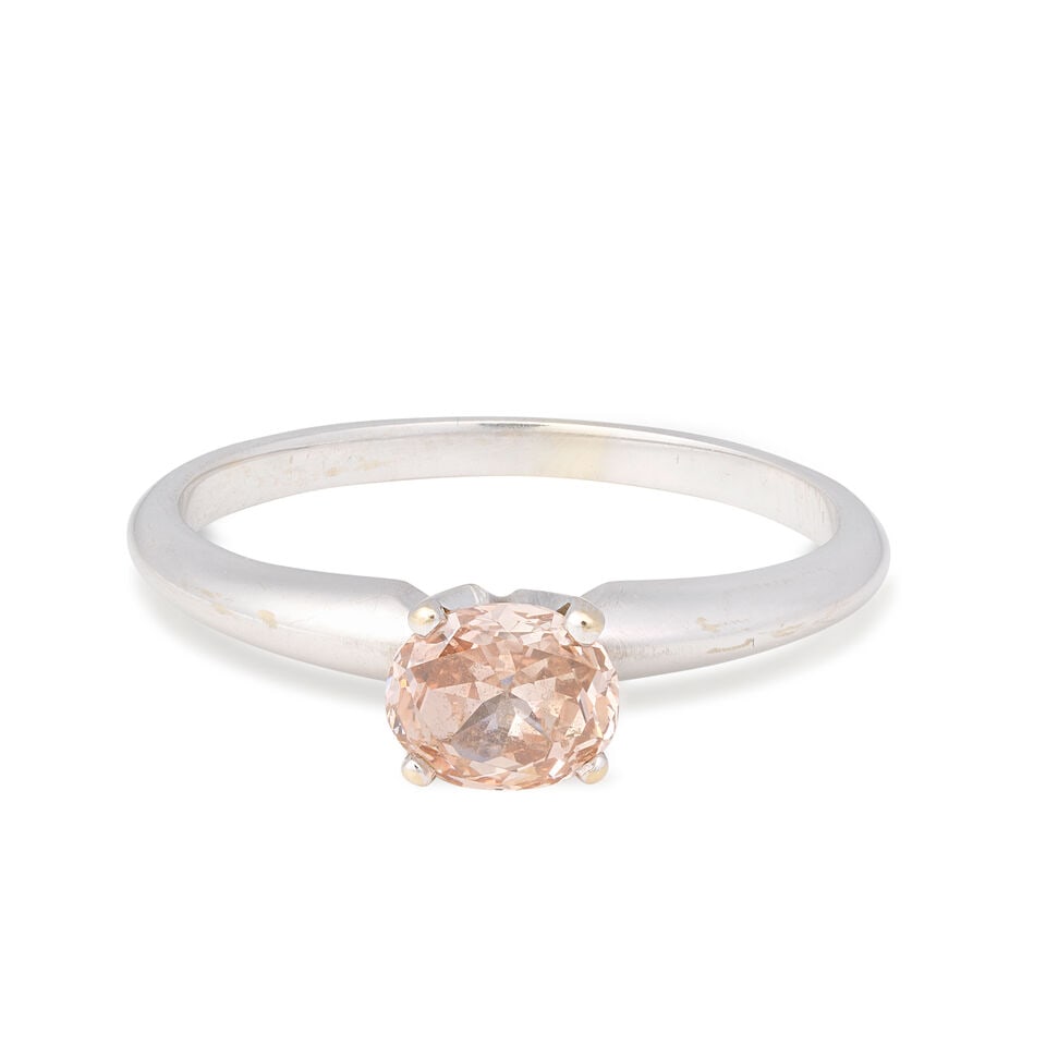 COLOURED DIAMOND RING: COLOURED DIAMOND RING Oval-cut fancy brown-pink diamond 0.48 carat Ring size approx. J Weight approx. 1.5g Footnotes: GIA: Natural fancy brown-pink colour, 0.48 carat, report no. 13441417, 29th July