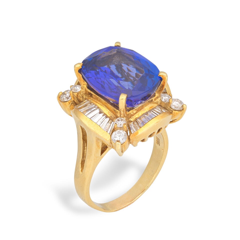 TANZANITE AND DIAMOND RING: TANZANITE AND DIAMOND RING Cushion-shaped tanzanite Brilliant and tapered baguette-cut diamonds approx. 1.25cts total Ring size approx. O Weight approx. 15.0g Footnotes: OVERALL CONDITION Light
