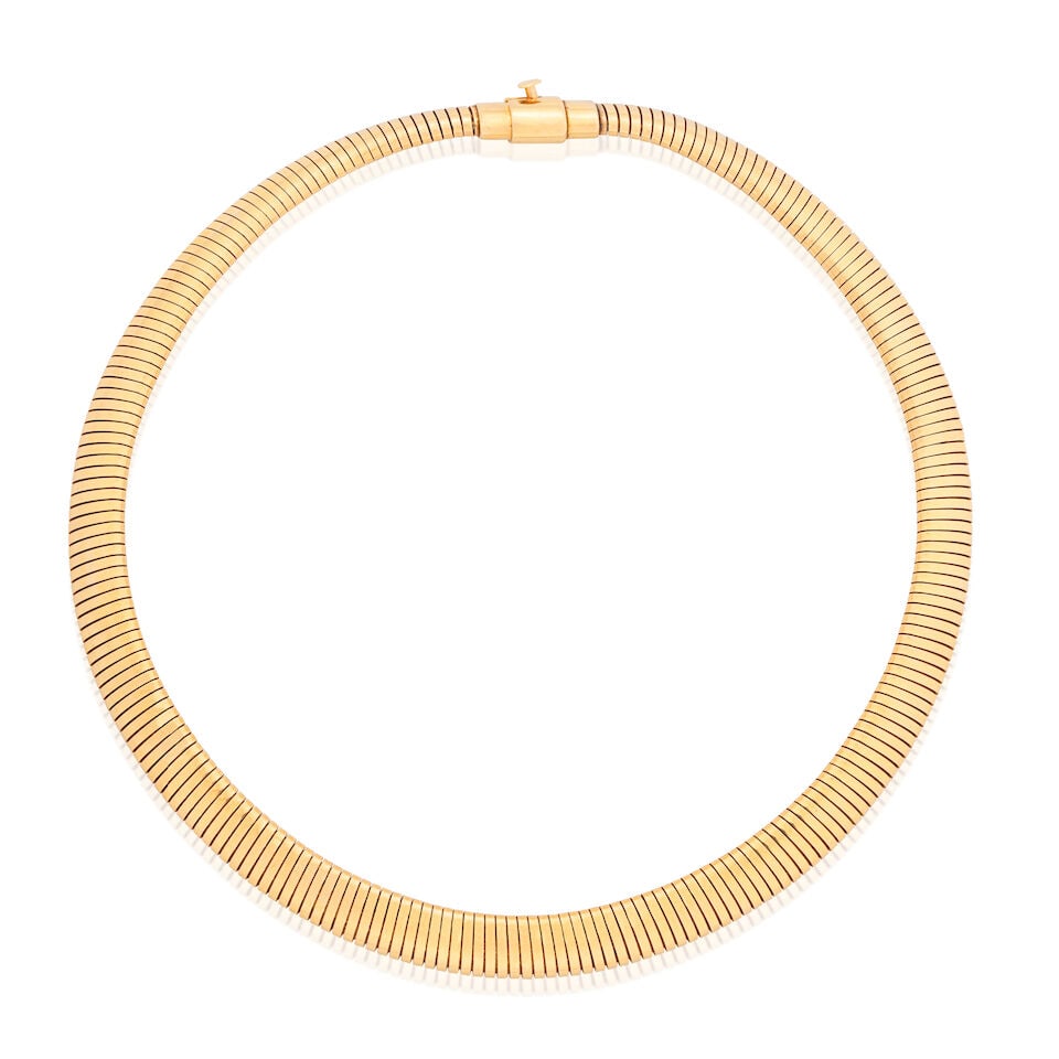 CARTIER: TUBOGAS COLLAR NECKLACE: CARTIER: TUBOGAS COLLAR NECKLACE Signed Cartier Inner circumference approx. 36.0cm Weight approx. 71.0g Footnotes: OVERALL CONDITION Of highly flexible, sprung design. Light surface wear to yellow