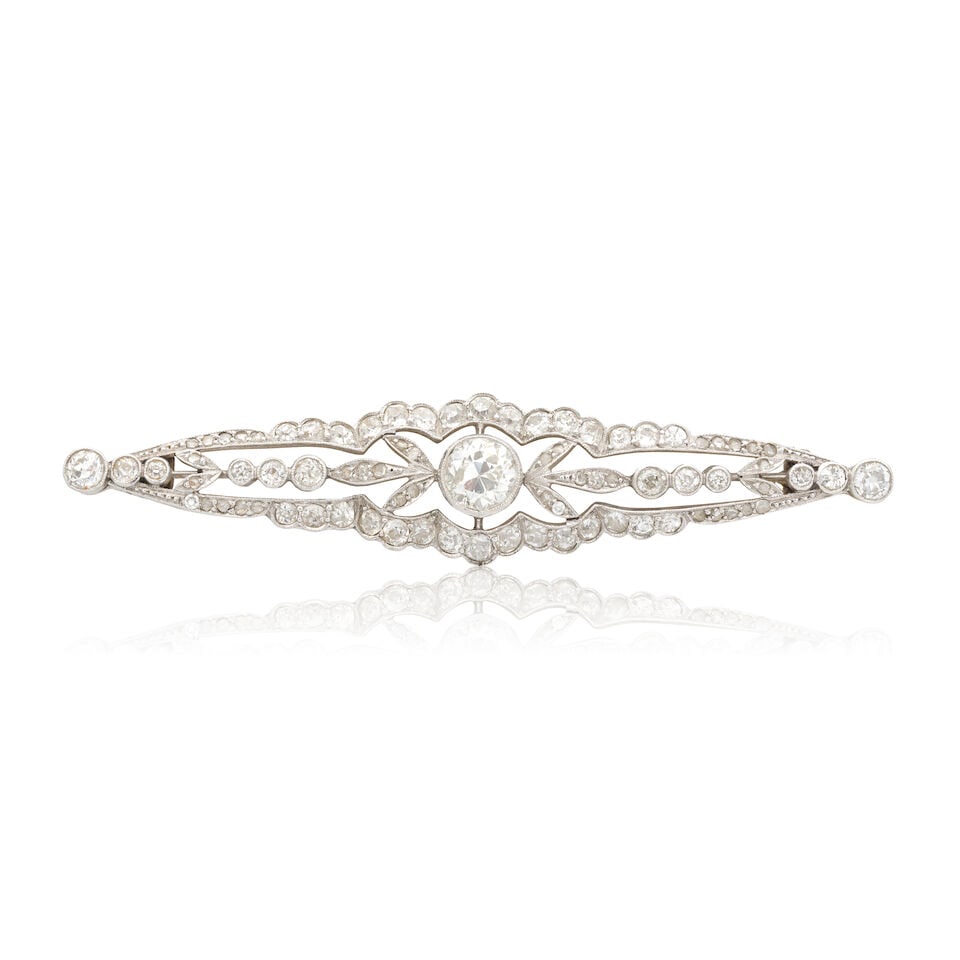 DIAMOND BAR BROOCH, CIRCA 1910: DIAMOND BAR BROOCH, CIRCA 1910 Old brilliant, single and rose-cut diamonds approx. 1.95cts total Length 6.0cm Weight approx. 6.5g Footnotes: Please note this lot has VAT at the prevailing rate on