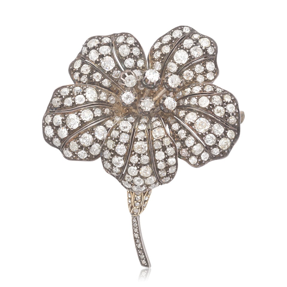 DIAMOND FLOWER BROOCH: DIAMOND FLOWER BROOCH Old brilliant and single and rose-cut diamonds approx. 6.15cts total Length 6.0cm Weight approx. 29.5g Footnotes: OVERALL CONDITION Some surface wear commensurate with age to unh