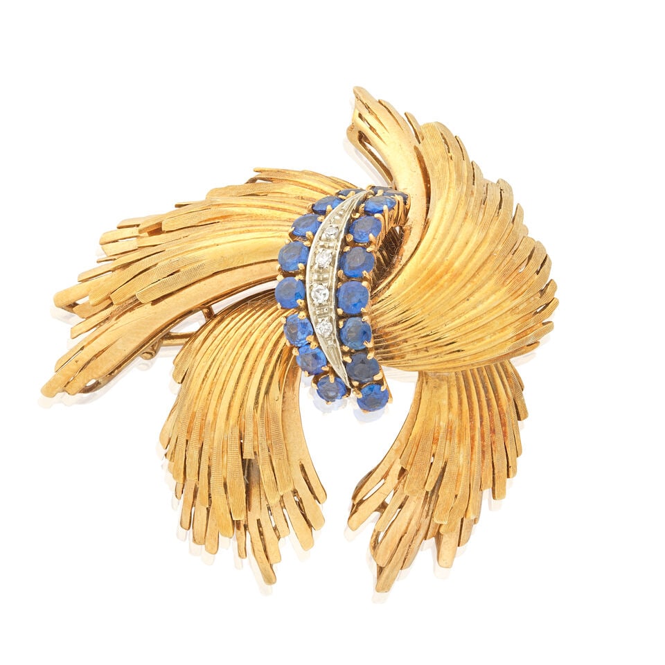 SAPPHIRE AND DIAMOND BROOCH, CIRCA 1980: SAPPHIRE AND DIAMOND BROOCH, CIRCA 1980 Circular-cut sapphires Single-cut diamonds 18 carat gold UK hallmark Length 4.0cm Weight approx. 15.5g Footnotes: OVERALL CONDITION Light surface wear to 18 car