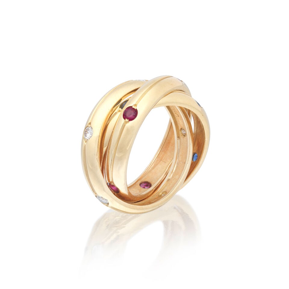 CARTIER: GEM-SET TRINITY RING: CARTIER: GEM-SET TRINITY RING Brilliant-cut diamonds approx. 0.20ct total Circular-cut rubies and sapphires Signed Cartier, numbered 279718, maker's mark, French assay mark Ring size approx. J Weight