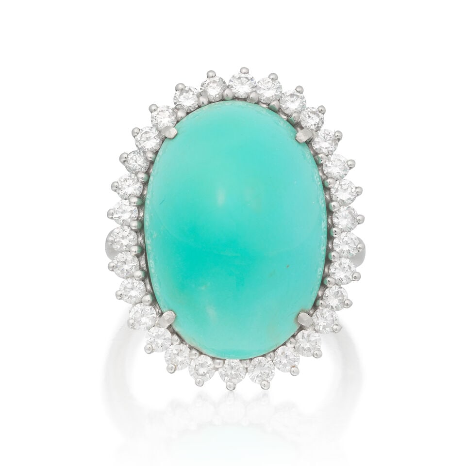 TURQUOISE AND DIAMOND CLUSTER RING: TURQUOISE AND DIAMOND CLUSTER RING Turquoise cabochon Brilliant-cut diamonds approx. 0.60ct total Ring size approx. J Weight approx. 9.0g Footnotes: GCS: A verbal report stating that the turquoise