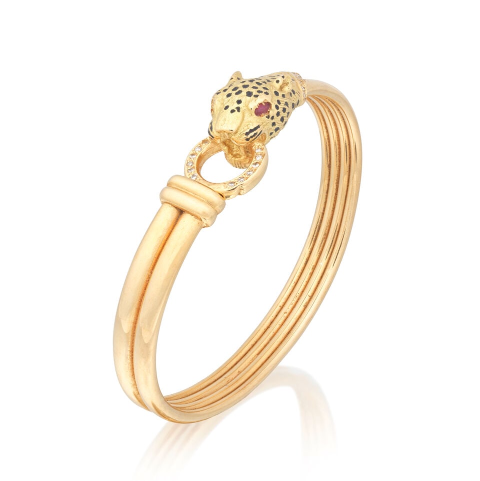 GAY FRÈRES: GEM-SET LEOPARD BANGLE: GAY FRÈRES: GEM-SET LEOPARD BANGLE Marquise-cut rubies Single-cut diamonds 18 carat gold London import mark Inner circumference approx. 16.5cm Weight approx. 28.5g Footnotes: OVERALL