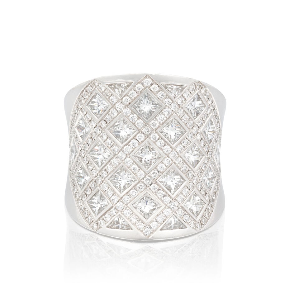 DIAMOND DRESS RING: DIAMOND DRESS RING Princess-cut diamonds approx. 3.90cts total Brilliant-cut diamonds approx. 2.00cts total Triangular-cut diamonds approx. 0.30ct total Ring size approx. N (leading edge) Weight